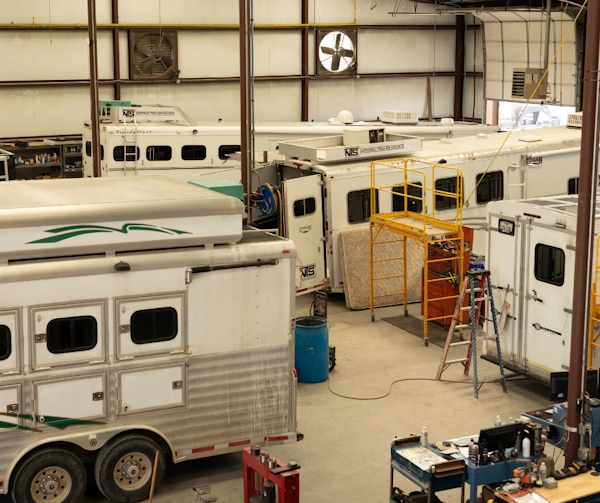Technician working on utility trailer